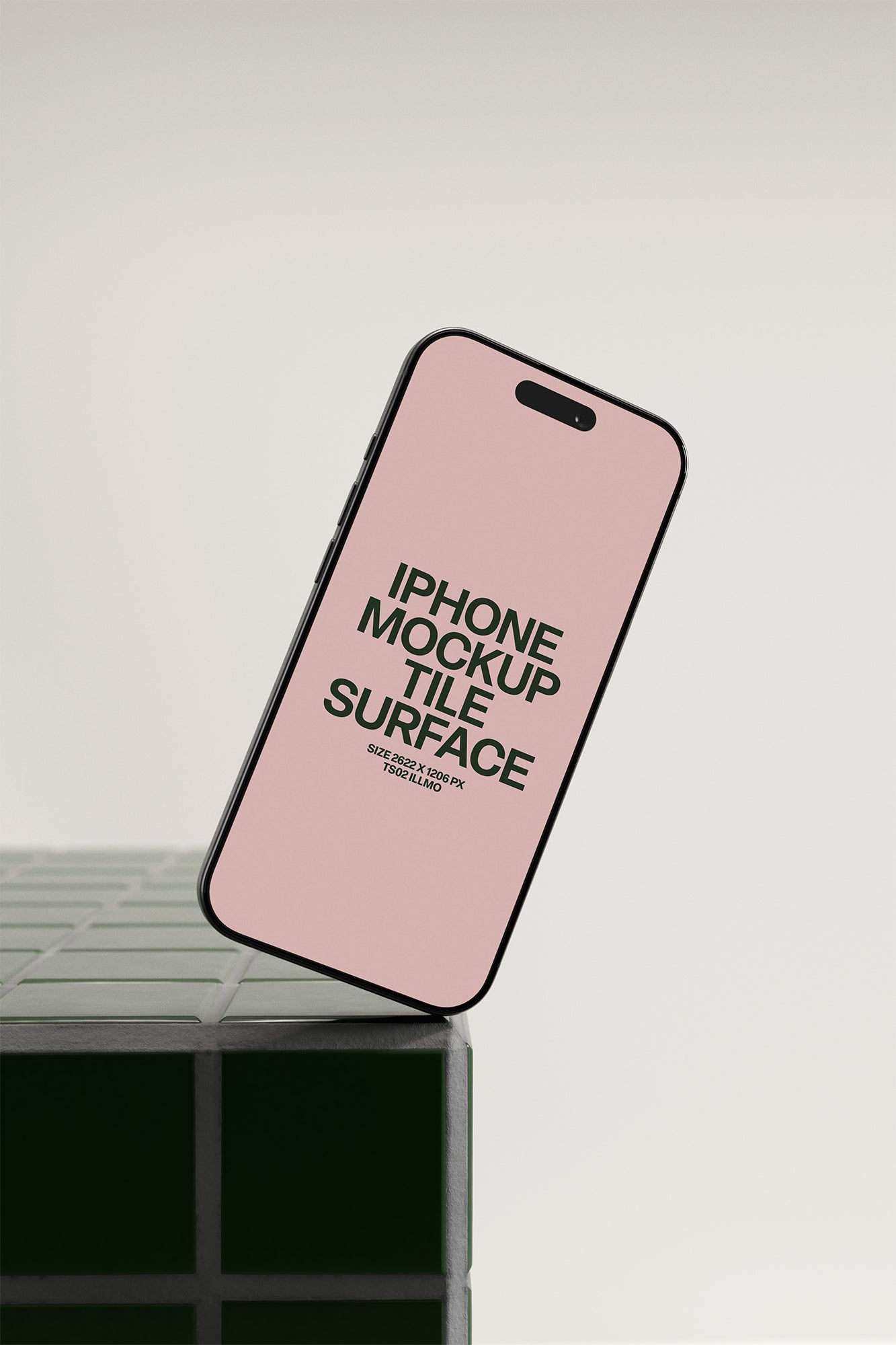 iPhone mockup on a green tile table with a pink UI placeholder for web and desktop UI presentation, angled view