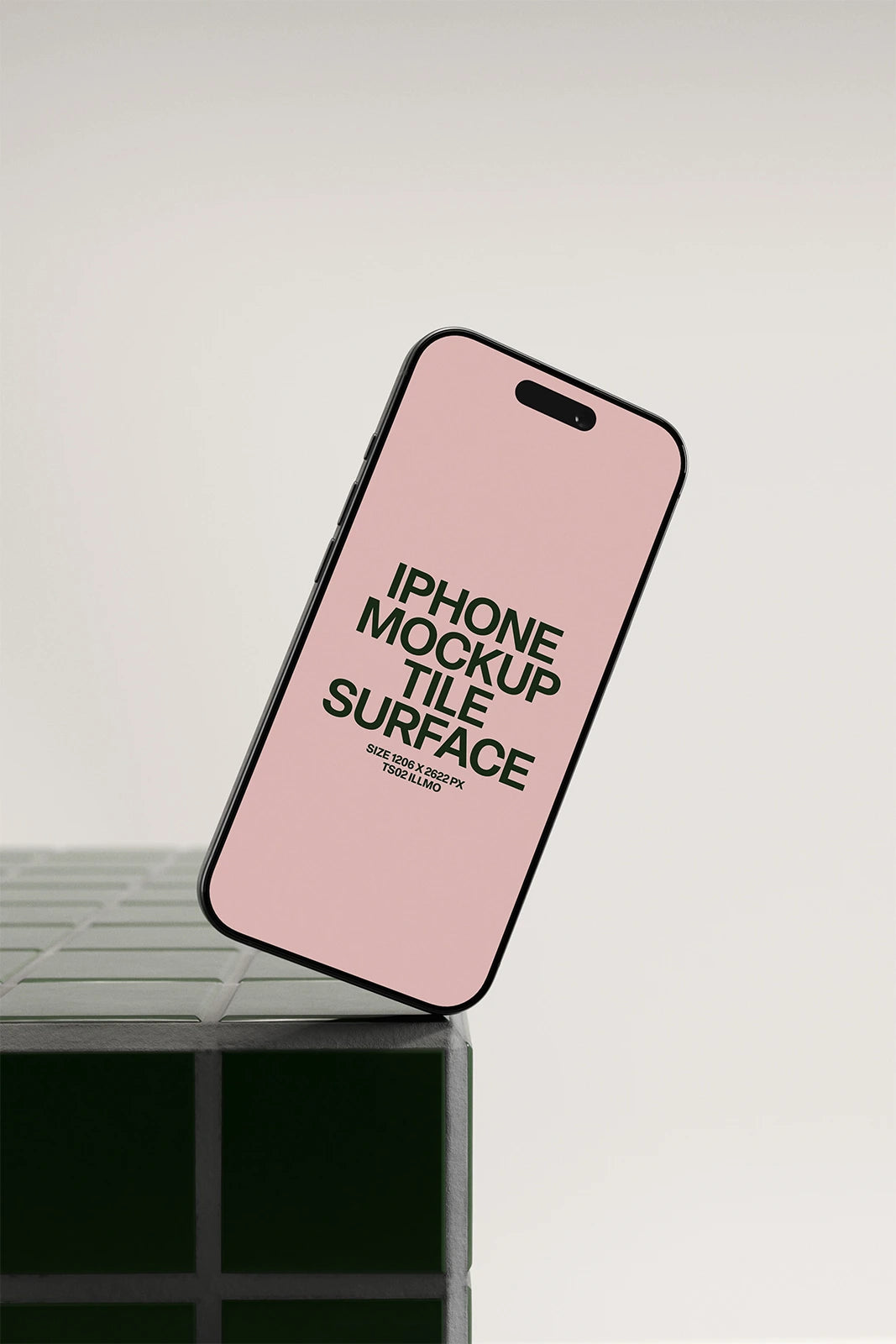 iPhone mockup on a green tile table with a pink UI placeholder for web and desktop UI presentation, angled view
