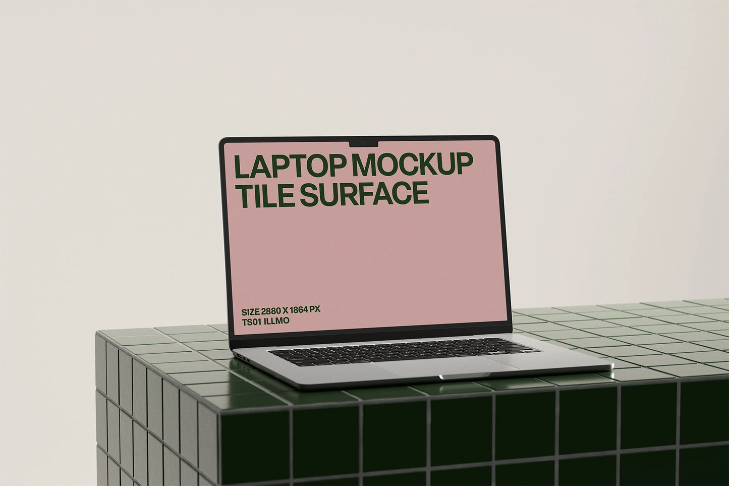 Laptop mockup on a green tile table with a pink UI placeholder for web and desktop UI presentation, angled view